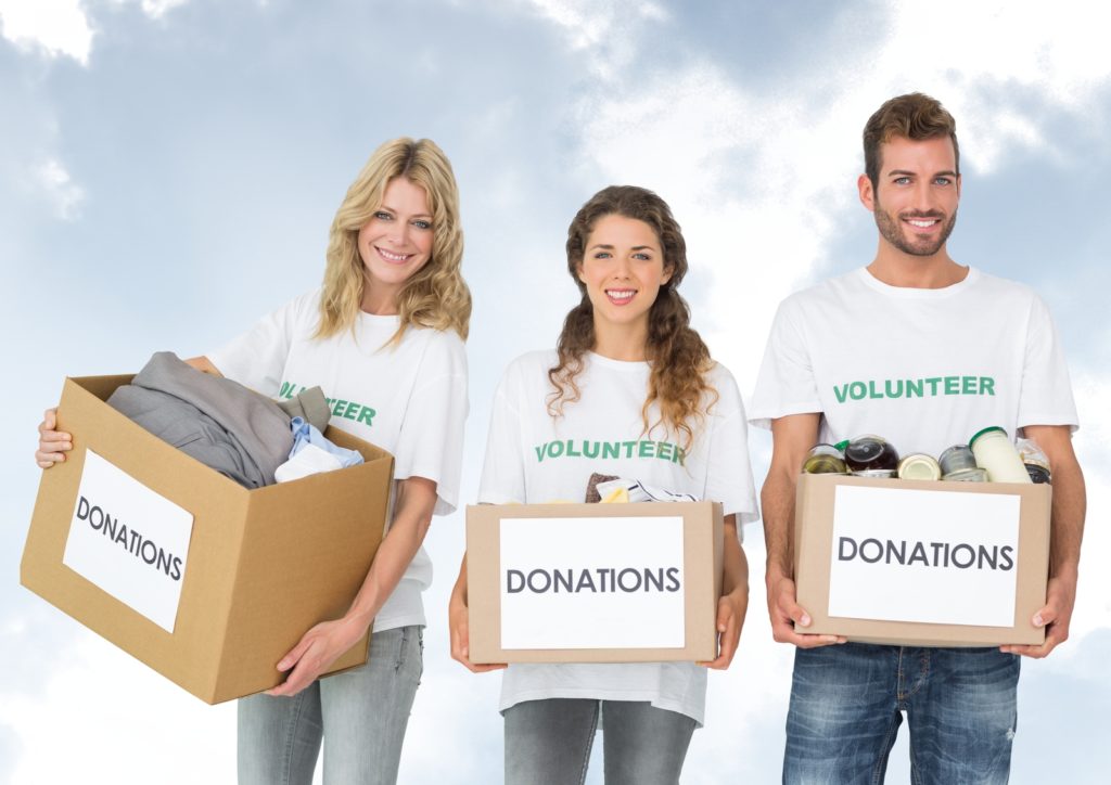 29300632_digital-composite-of-volunteers-carrying-donation-boxes-1024x724